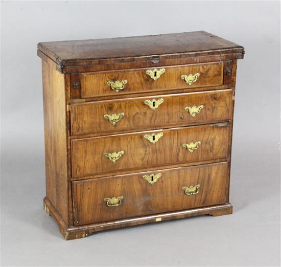 A George I featherbanded walnut bachelors chest, W.2ft 4in. D.1ft 1in. H.2ft 3in.